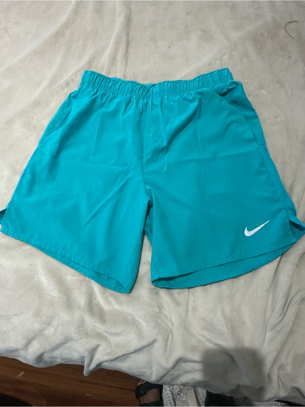 Nike Turquoise Running Shorts with White Swoosh